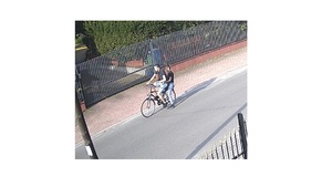 Wizerunek dwóch mężczyzn na rowerze